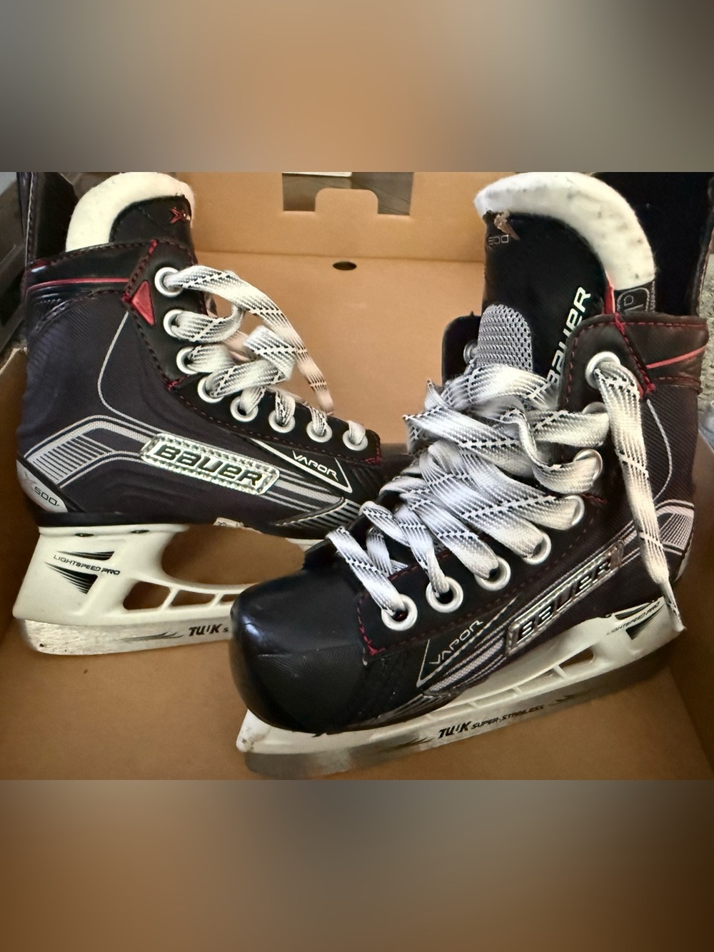 Bauer Vapor X500 Youth Black and White Vapor Hockey Skates with Red Accents